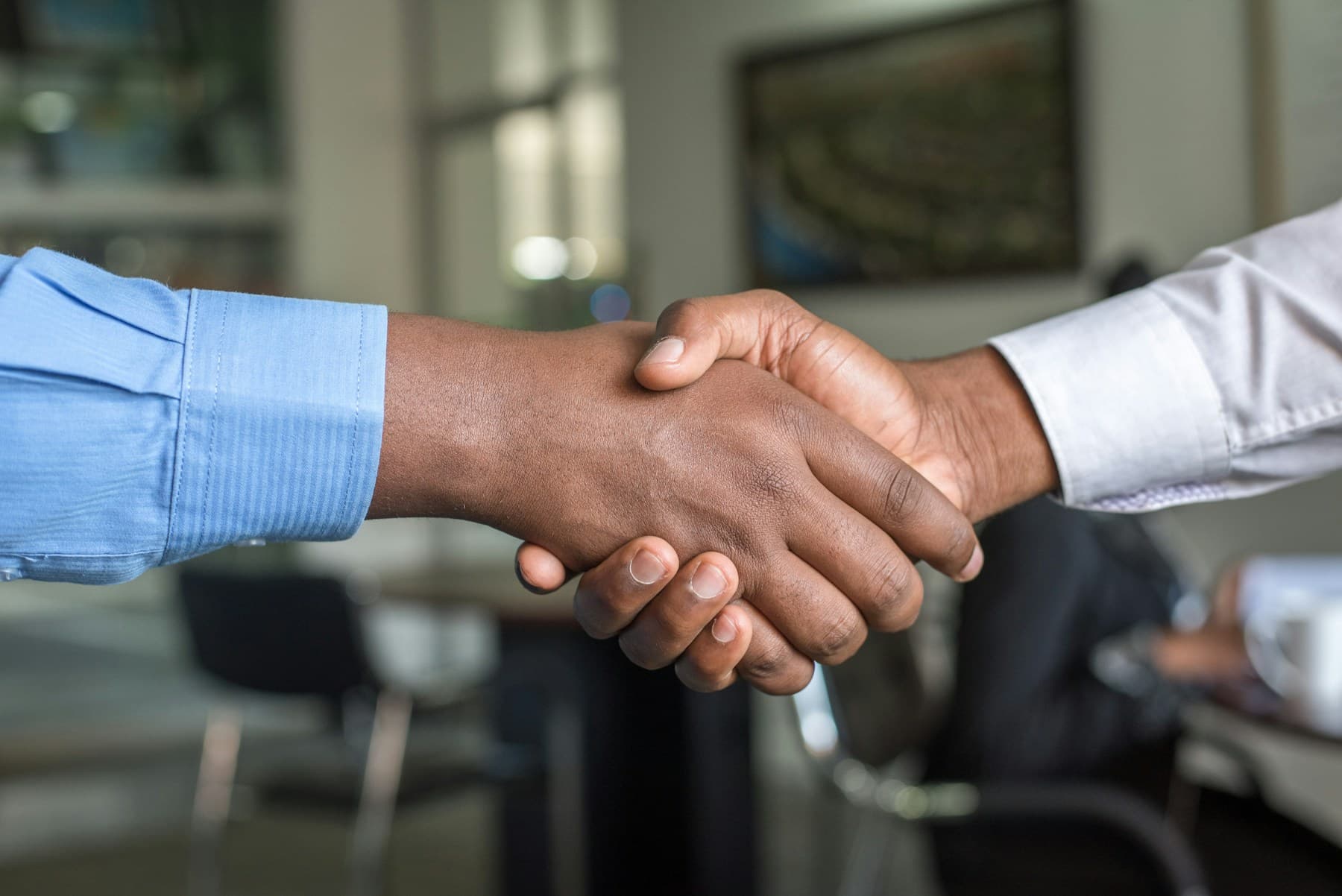 A collaborative software partnership beginning with a handshake