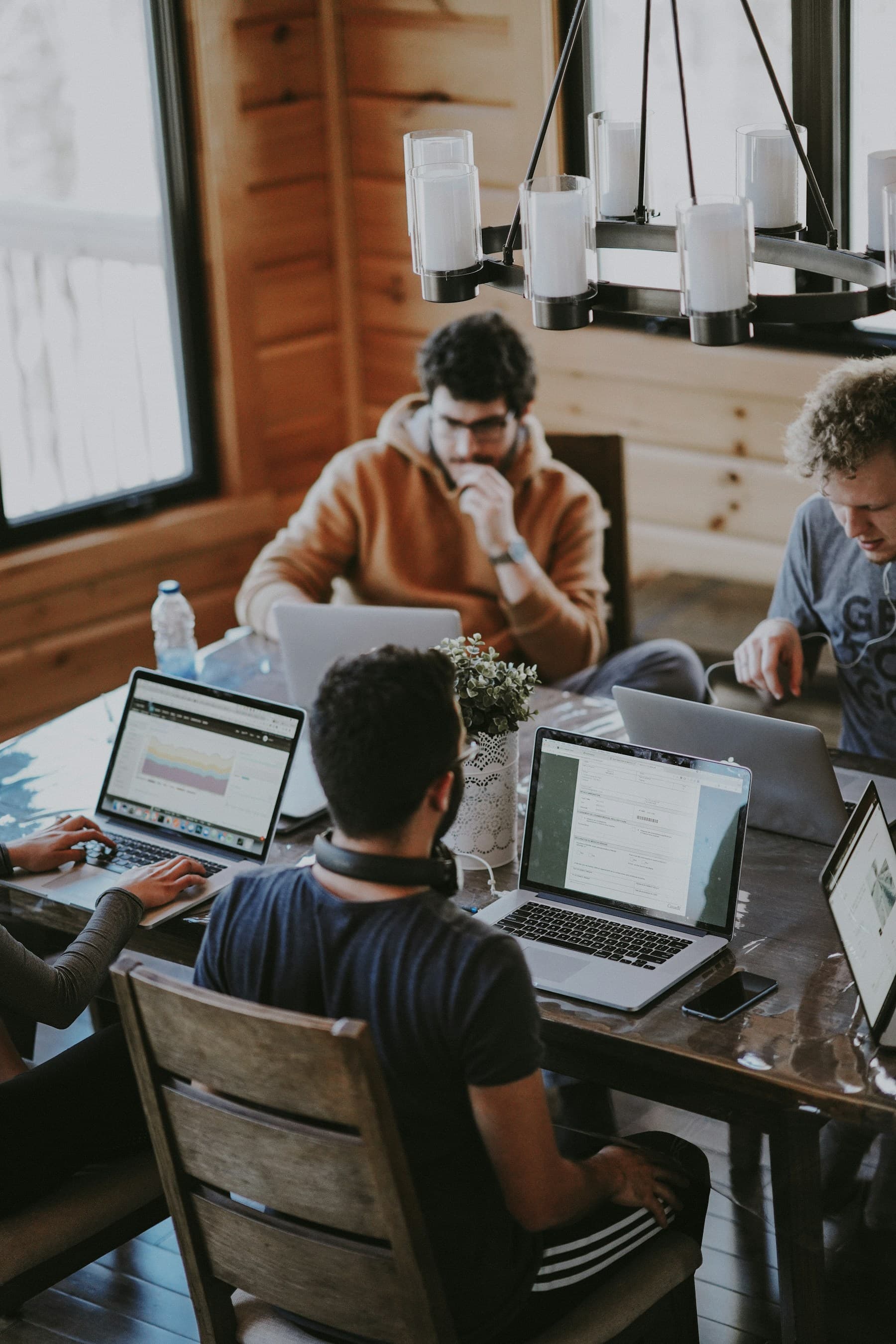 A cross-functional product team collaborating around a table